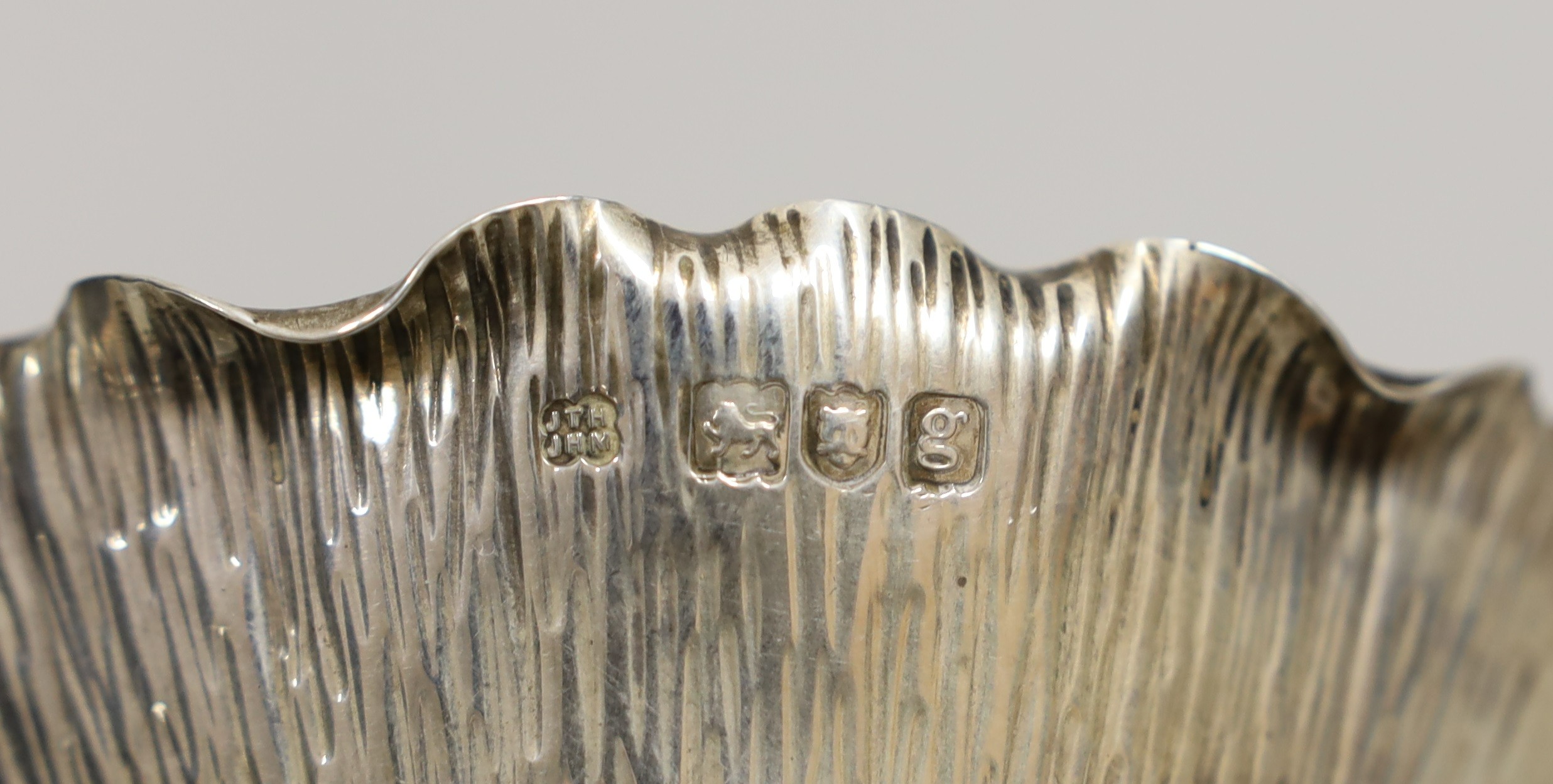 An Edwardian silver lotus shaped sugar bowl and matching sugar sifting spoon, by Hukin & Heath, London, 1902, bowl diameter 11.8cm, 7.5oz.